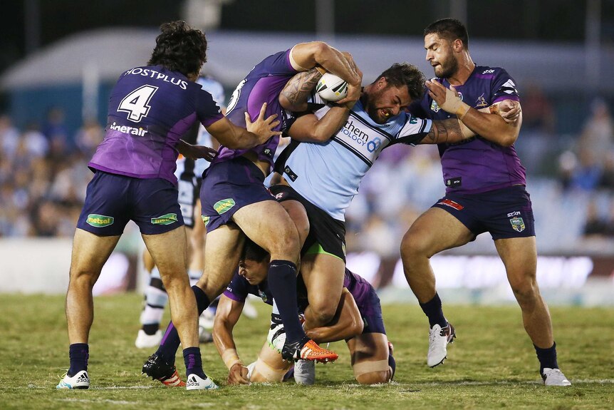 Andrew Fifita takes on Jesse Bromwich and the Melbourne Storm defence