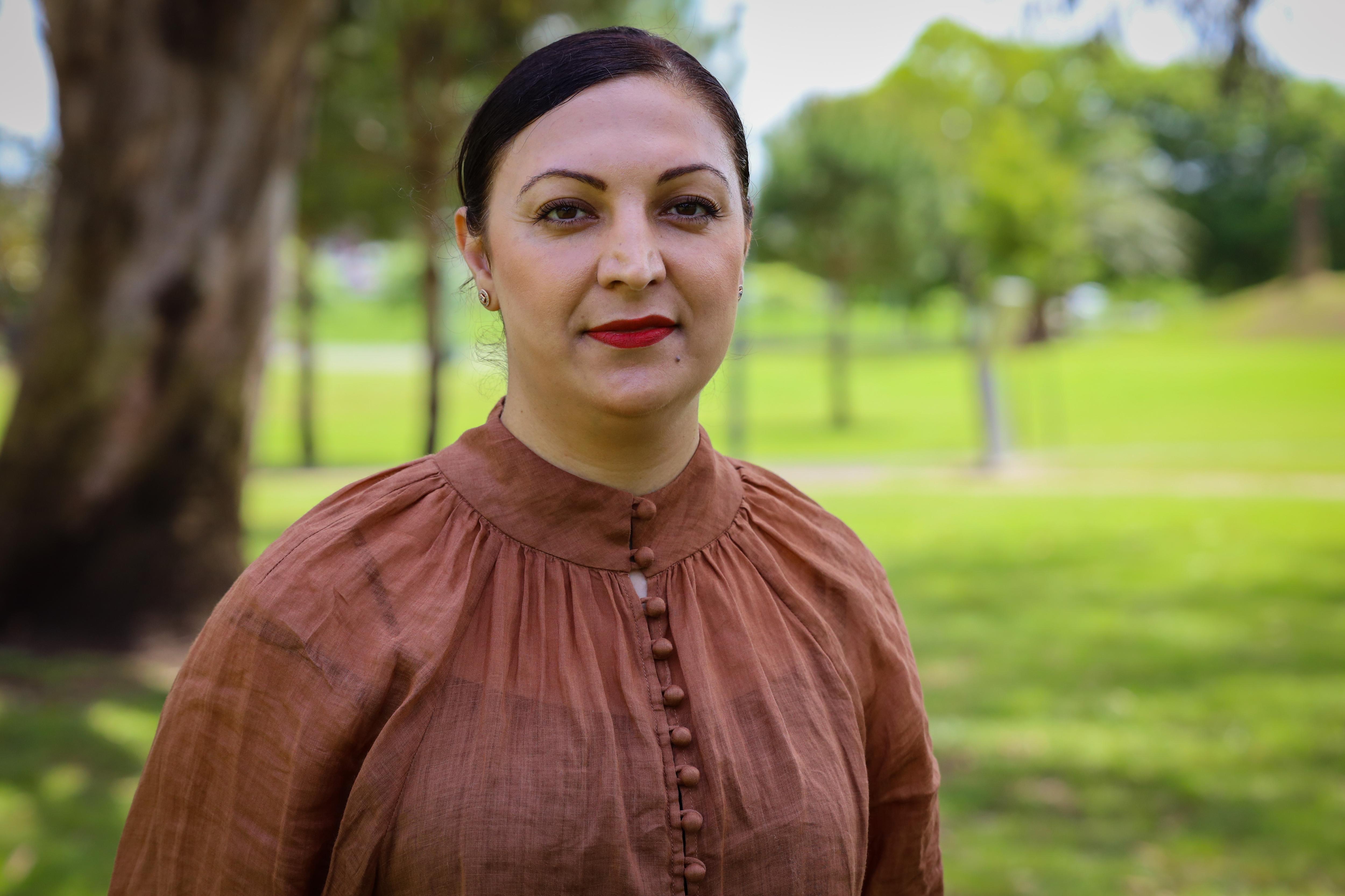 A woman smiling at the camera 