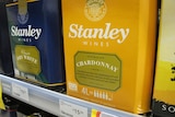 Two boxes.  One is yellow and the other blue, featuring the name of a cask wine company.