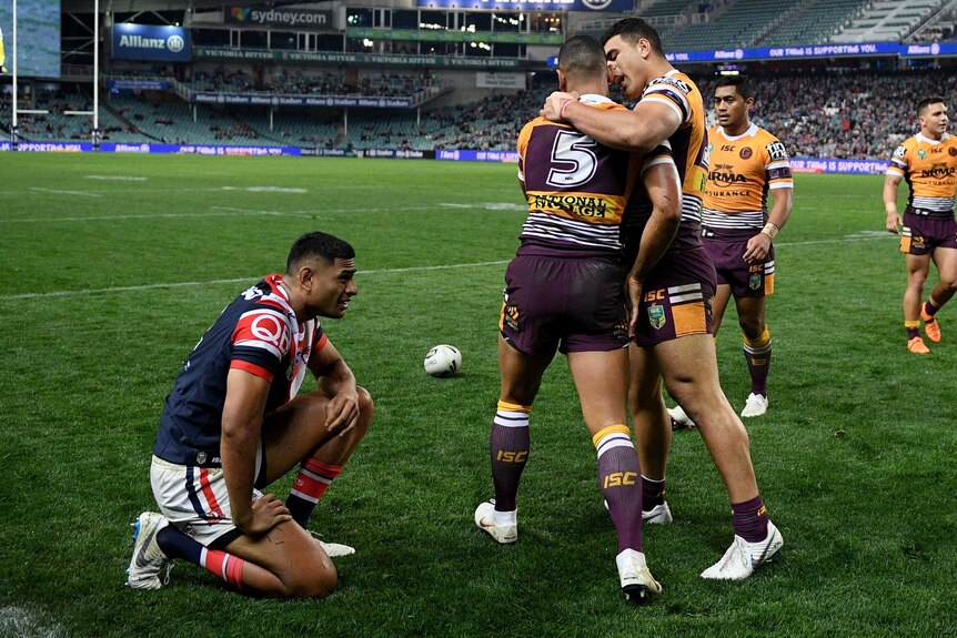Jamayne Isaako of the Broncos (L) celebrates a try with David Fifita against the Roosters.