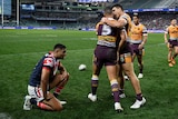Jamayne Isaako of the Broncos (L) celebrates a try with David Fifita against the Roosters.