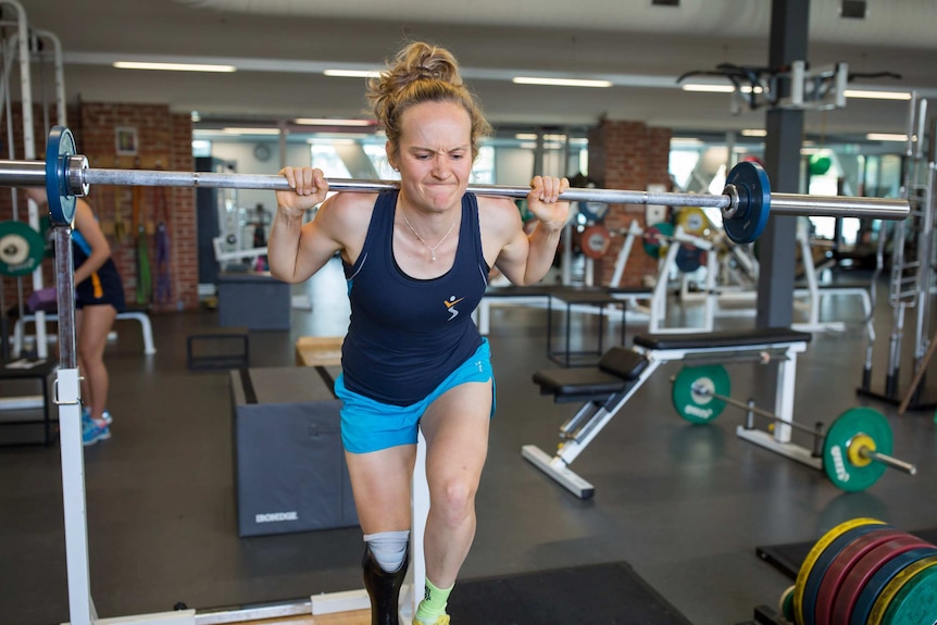 Hannah McDougall lifts weights in a Melbourne gym.