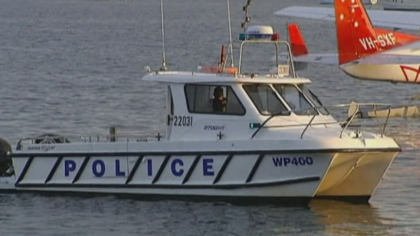 A Police vessel searches for a missing person near Vaucluse, Sydney