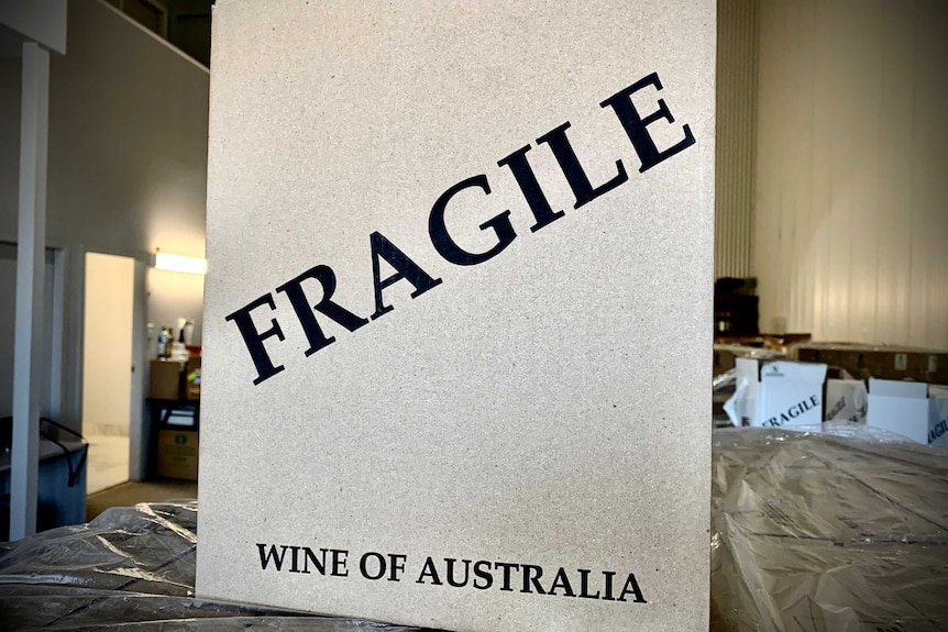 Sign on a box reads: Fragile, Wine of Australia