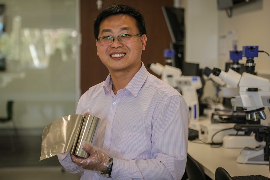 Associate Professor Laichang Zhang with his metallic glass.