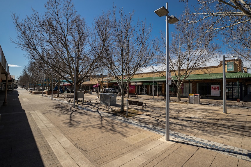 The near-empty Maude Street Mall, on a clear bright day with blue skies.