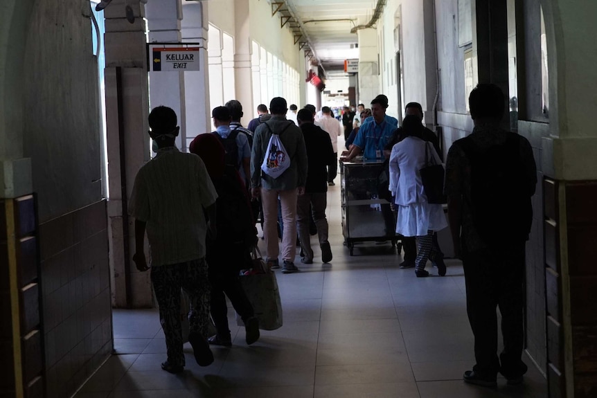 People crowd into a busy corridor at the Cipto Mangunkusumo hospital in Jakarta.