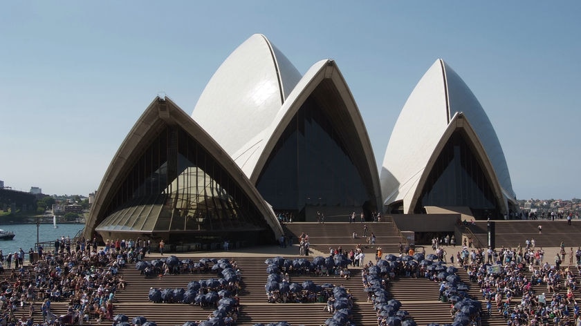 Supplied photo of climate change activists forming the numerals at the Sydney Opera House in