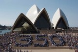Supplied photo of climate change activists forming the numerals at the Sydney Opera House in