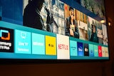 A smart tv with various streaming app logos on display. 