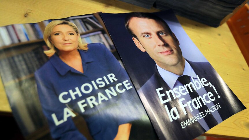 Posters for French presidential candidates Marine Le Pen and Emmanuel Macron