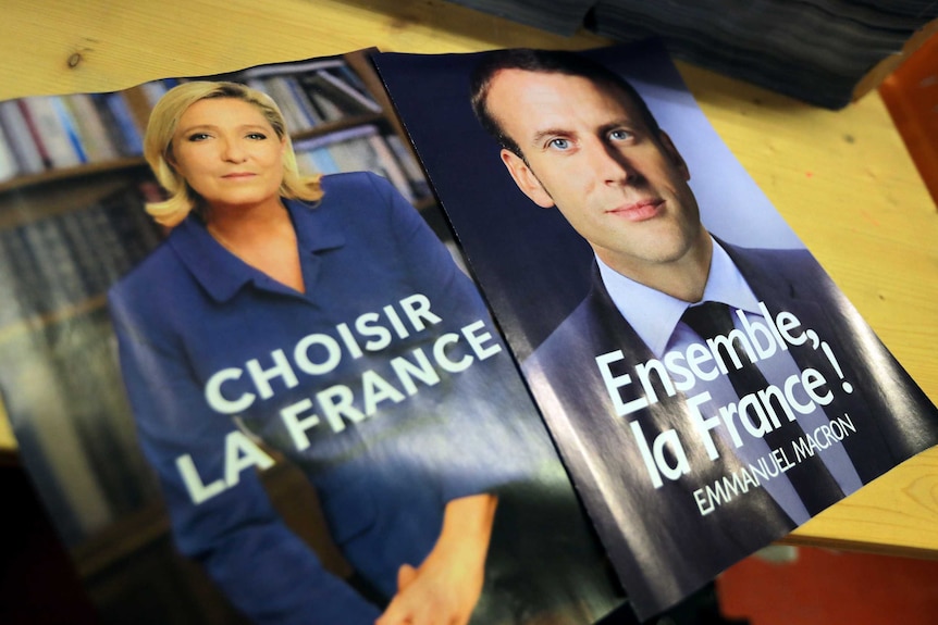 Posters for French presidential candidates Marine Le Pen and Emmanuel Macron