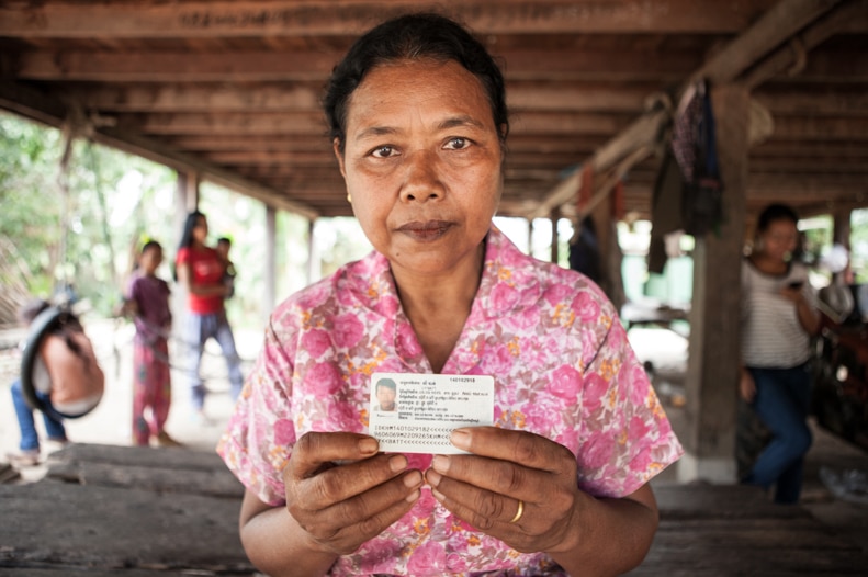 Sum Tea holds a photo of her son