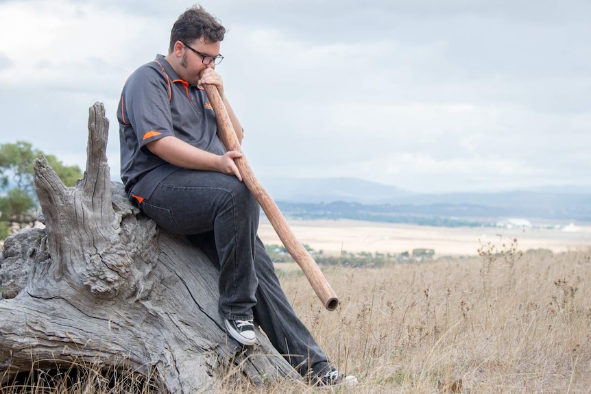 Jayden Goodrem playing the didgeridoo