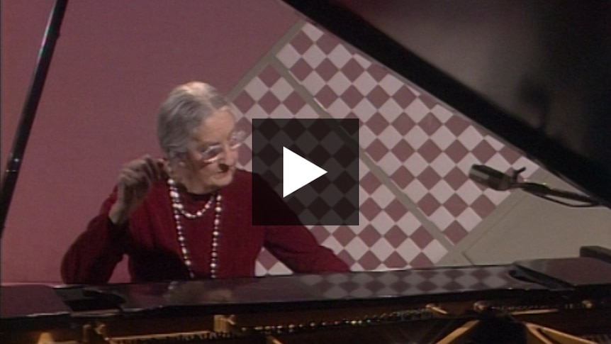 Miriam Hyde playing a grand piano.
