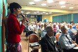 Kate Washington addresses the community meeting