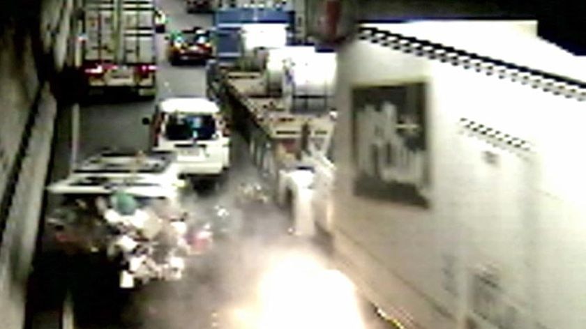 The first fire breaks out after the accident in the Burnley tunnel.