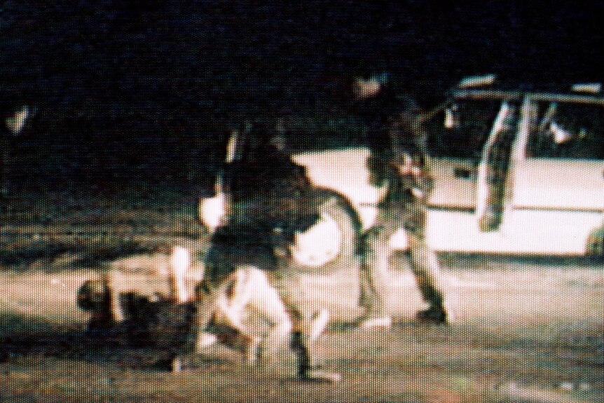 Rodney King (on ground) is beaten by police officers in 1991.