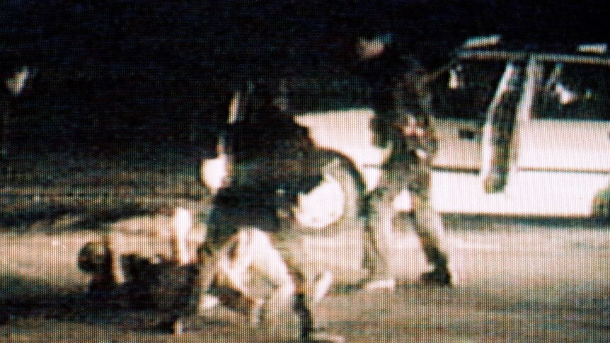 Rodney King (on ground) is beaten by police officers in 1991.