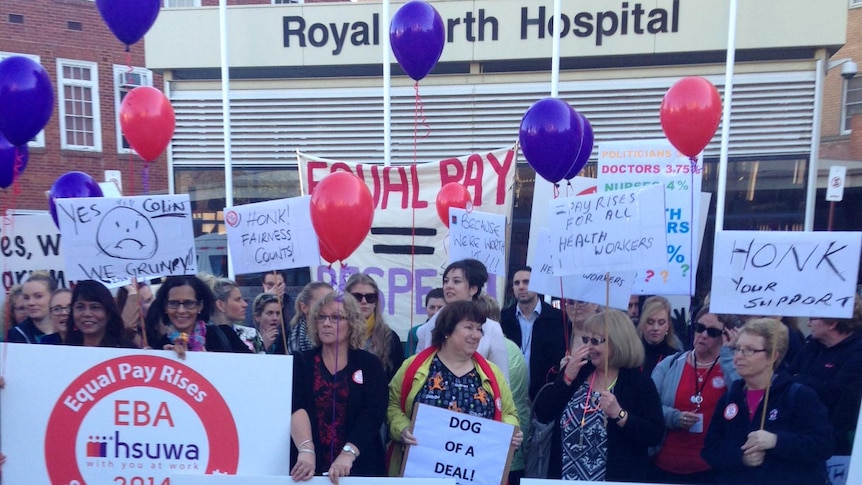 Health workers rally outside Royal Perth Hospital in a pay dispute.