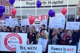 Health workers rally outside Royal Perth Hospital in a pay dispute.