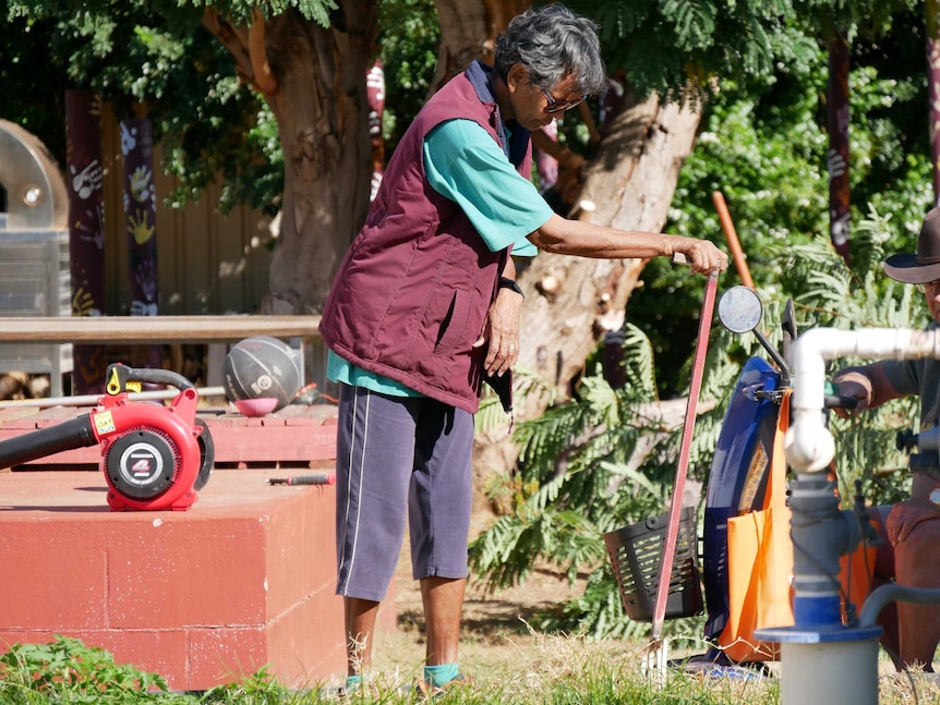 woman gardening with pitchfork