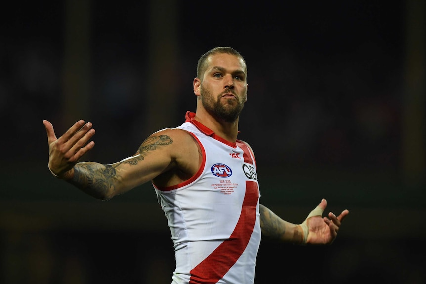 Lance Franklin stretches out his arms after his goal for Sydney against Collingwood