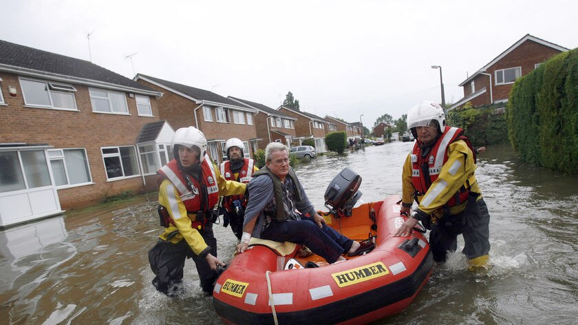 Floods: A man is rescued in Tewkesbury, central England