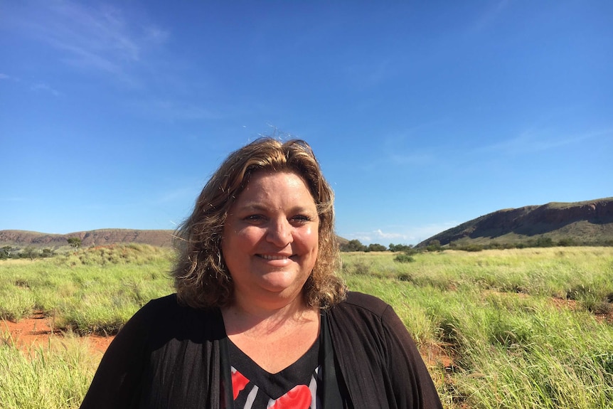 Sandy Robertson in front of the Rawlinson Range at Warakurna.