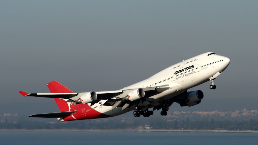 A Qantas plane takes off over Sydney.