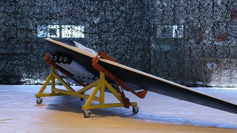 A Saegheh drone equipped with four bombs sits in a warehouse.