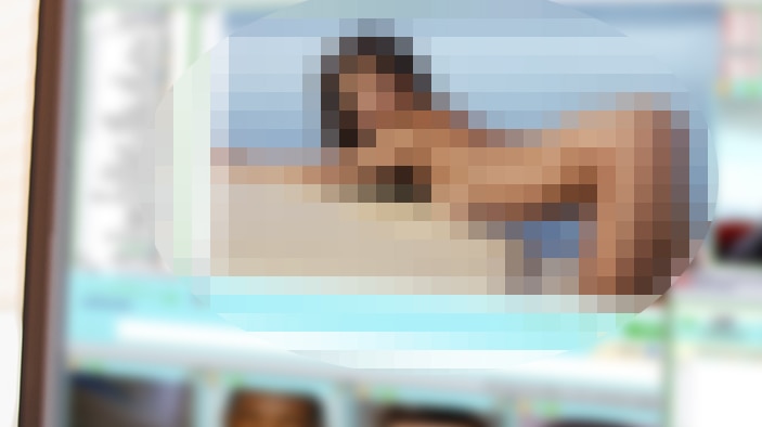 A pixelated pornographic image on a computer screen.