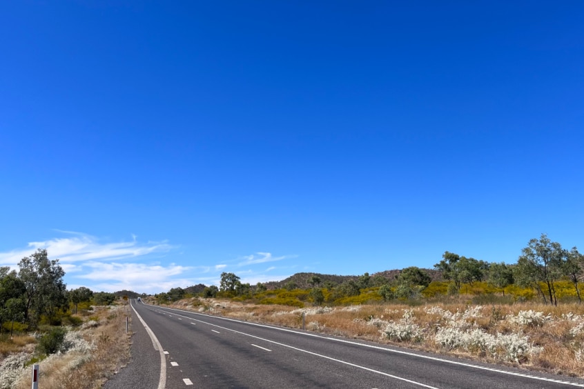 Dry, brown grass along a stretch of highway