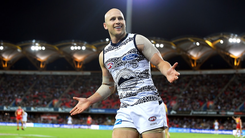 Gary Ablett reacts to Gold Coast crowd after kicking goal for Geelong