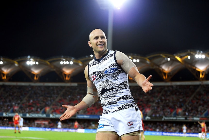 Gary Ablett reacts to Gold Coast crowd after kicking goal for Geelong