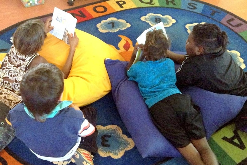 Younger students reading at the Warburton Campus of the Ngaanyatjarra Lands School.