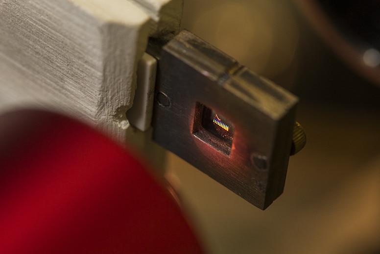 Close up of a small chip that can hold hundreds of thousands on nanoparticles