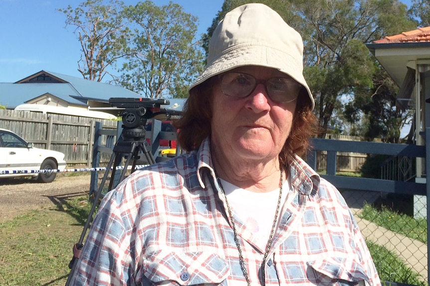 Maggie Nuis spent the night on the footpath at Lorikeet Street, Inala, during the police siege