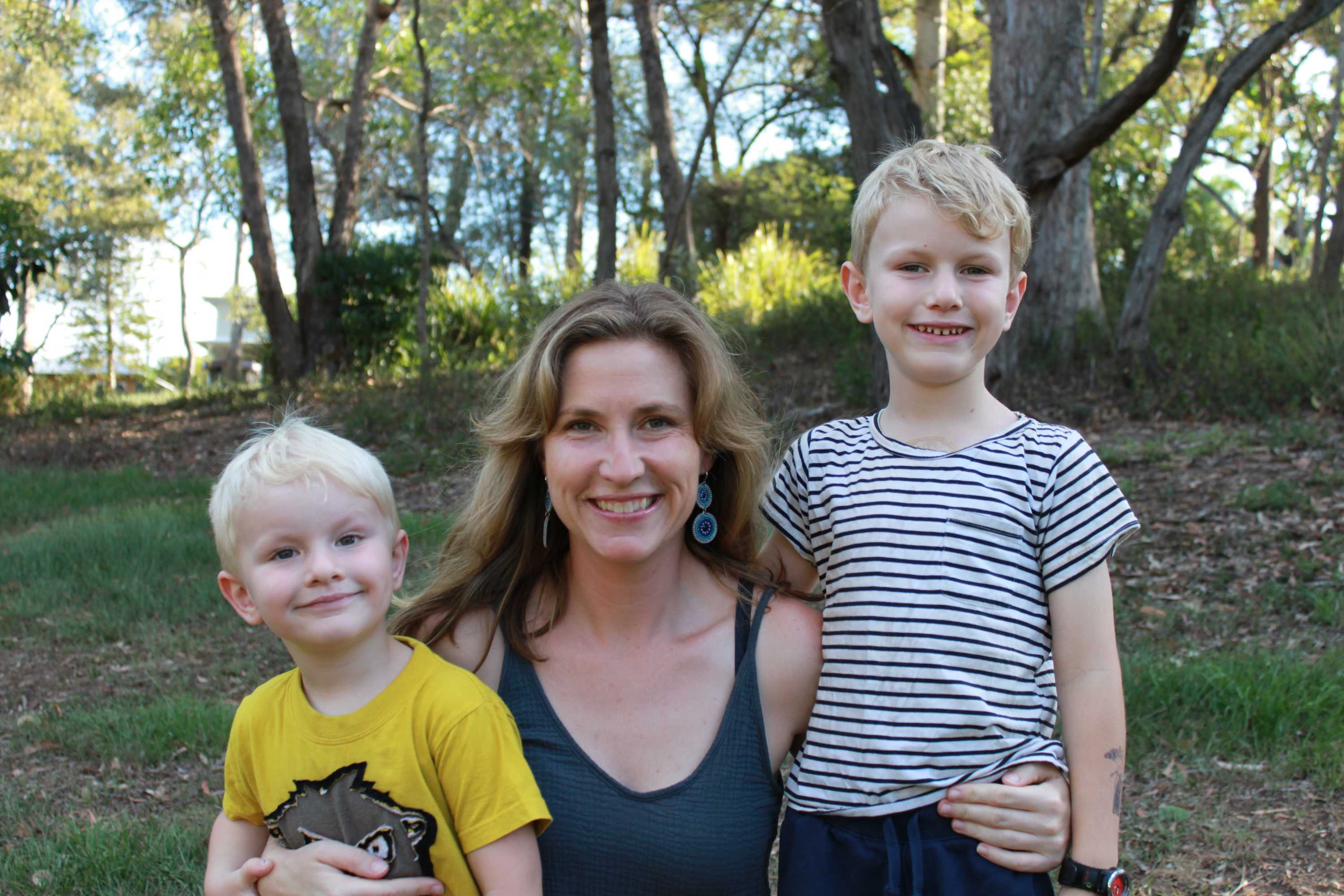 Journalist Gemma Breen stands with her two young children, Oscar, 3, and Leo, 6.