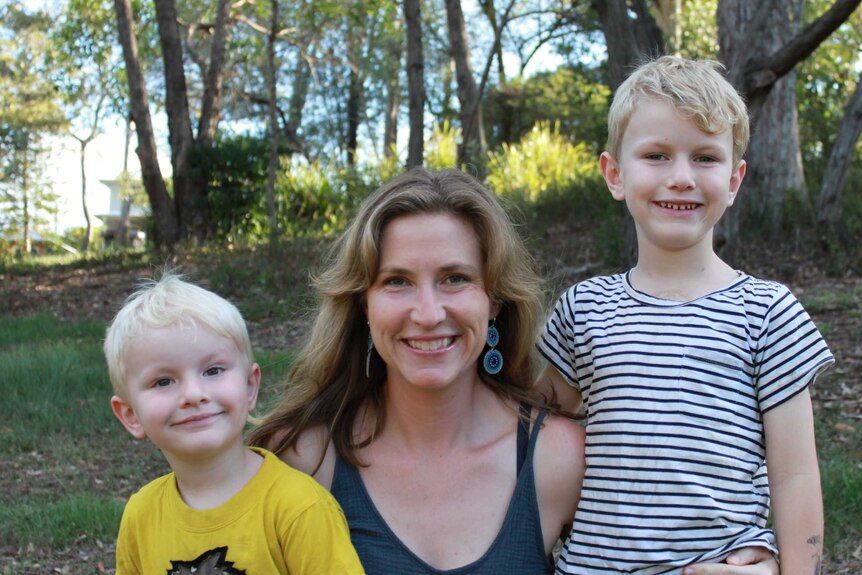 Journalist Gemma Breen stands with her two young children, Oscar, 3, and Leo, 6.
