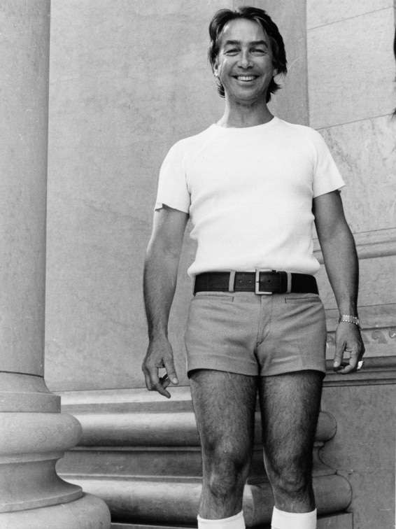 Don Dunstan stands outside Parliament House in his infamous pink shorts.