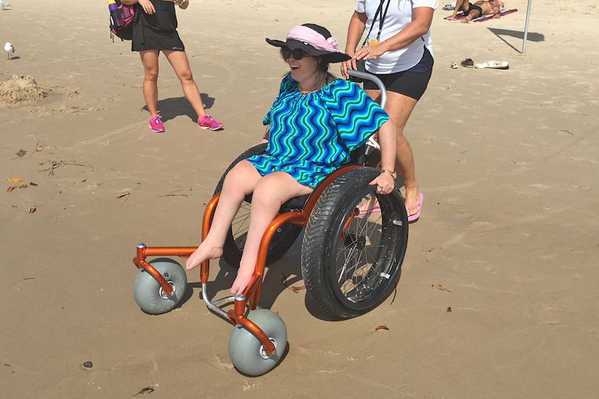 Gold Coast local Emma Sheehy uses a beach-accessible wheelchair