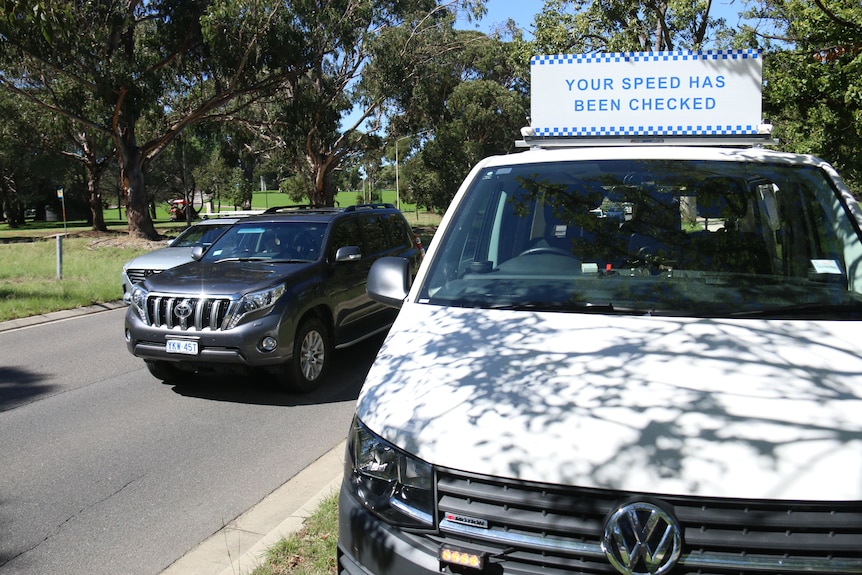 A white van with a mobile camera sign.