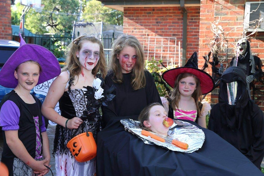 Kids dressed up in Halloween costumes