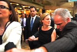 Kristy Fraser-Kirk walks past media as she leaves the Australian Human Rights Commission on Friday