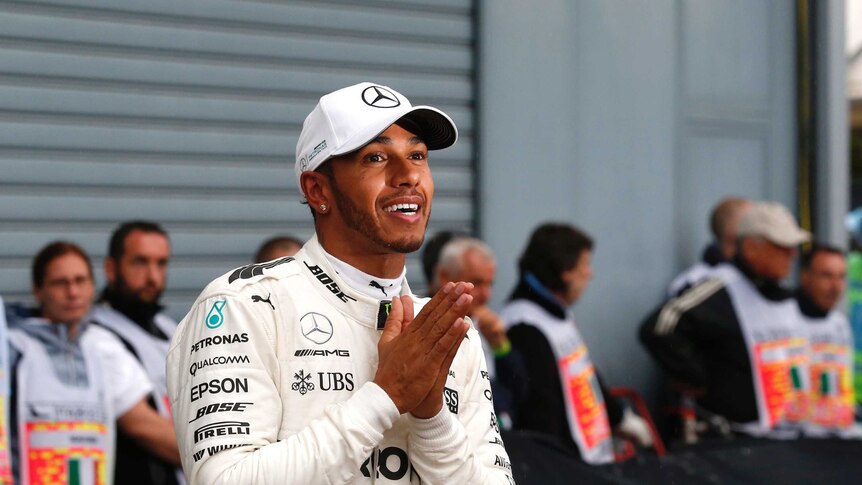 Lewis Hamilton looks happy after claiming his 69th career pole position.