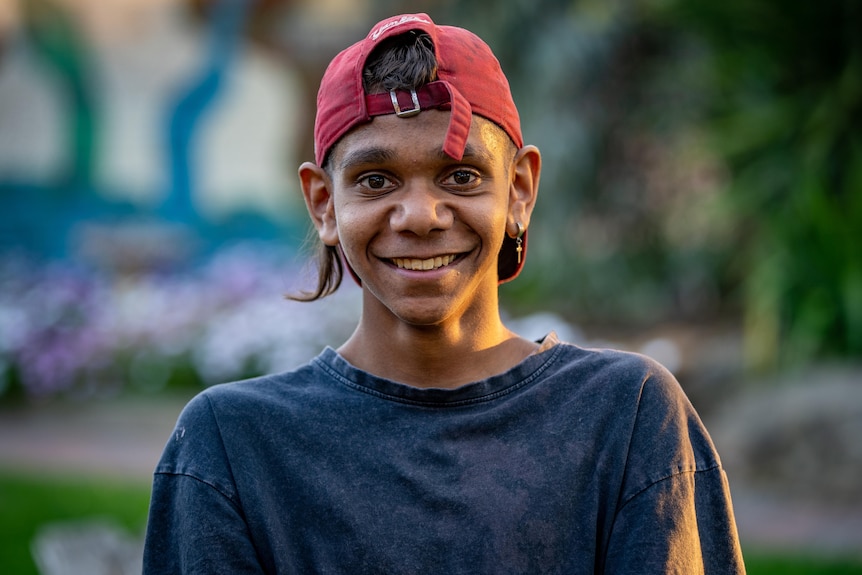 A young native boy smiling