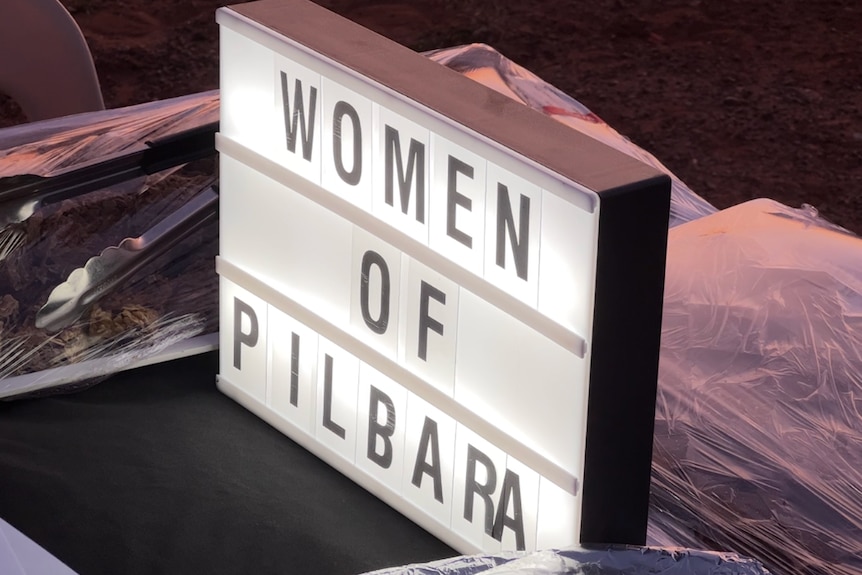 Signage reading Women of Pilbara.