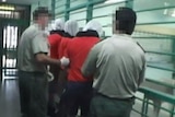 Don Dale detainees in hoods at Berrimah adult prison in August 2014.