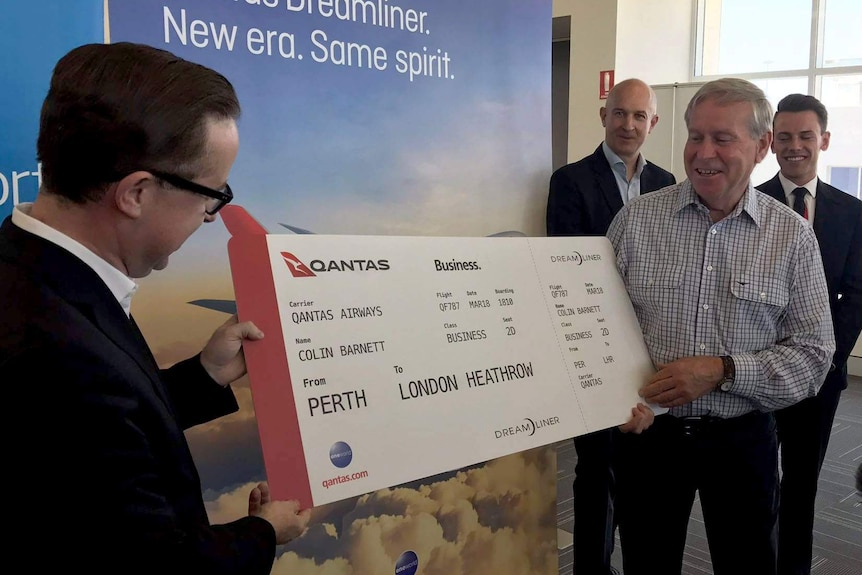 WA Premier Colin Barnett and Qantas CEO Alan Joyce with a giant cardboard airline ticket.